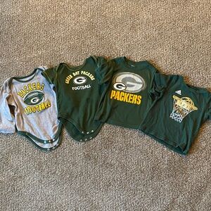 18 month Green Bay Packers and one Bucks Shirt